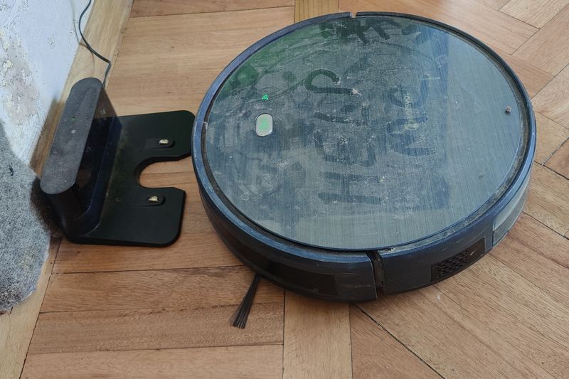 Person vacuuming a home floor